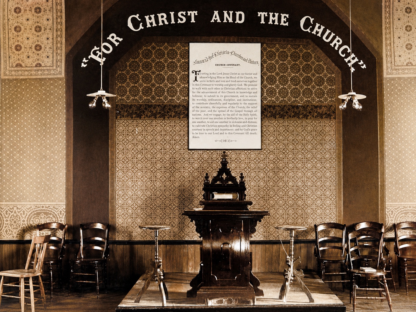 A historic chancel beneath the words For Christ and the Church