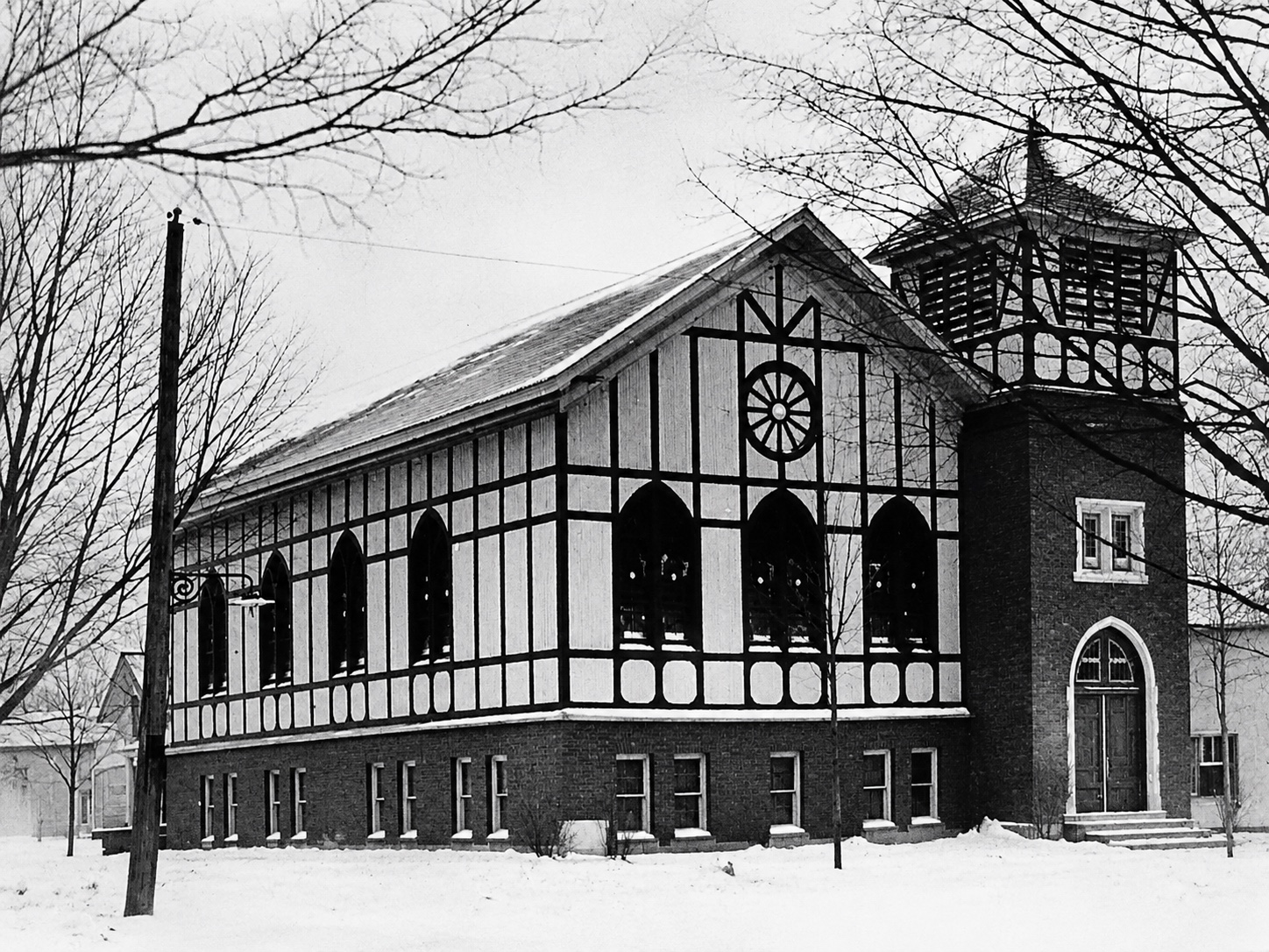 A Tudor-style church building in winter